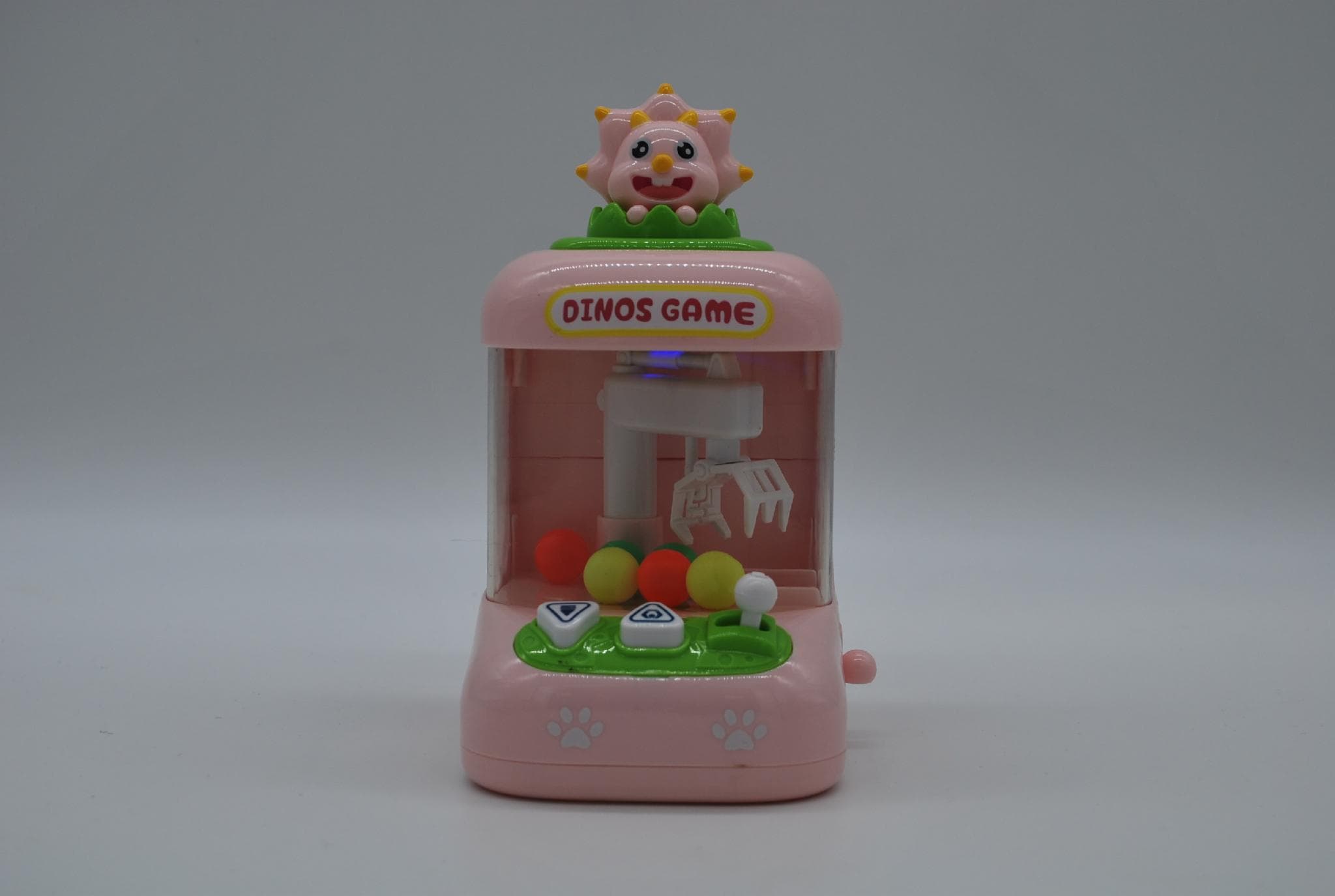 Дитячий ігровий міні автомат Клешня Хватайка Dinos Game Claw Machine підсвітка + музика, рожевий 18 см (2002001)